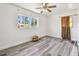 Bedroom with gray laminate flooring, natural light, and a neutral color scheme at 3601 27Th S Ave, St Petersburg, FL 33711