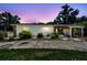 Charming single-story home featuring stone accents, a covered carport, and well-maintained landscaping at 3601 27Th S Ave, St Petersburg, FL 33711