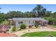 Charming single-story home with well-maintained landscaping, covered porch and a long driveway at 3601 27Th S Ave, St Petersburg, FL 33711