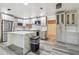 Modern kitchen featuring gray cabinetry, stainless steel appliances, a center island, and stylish backsplash at 3601 27Th S Ave, St Petersburg, FL 33711