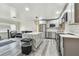 Contemporary kitchen boasts gray cabinets, stainless steel appliances, and a center island with countertop seating at 3601 27Th S Ave, St Petersburg, FL 33711