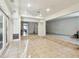 A large empty living room with tile flooring and recessed lights at 3601 27Th S Ave, St Petersburg, FL 33711