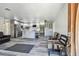 Open-concept living space flowing into a modern kitchen with stainless steel appliances and gray cabinetry at 3601 27Th S Ave, St Petersburg, FL 33711