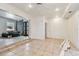 An empty living room with ceramic tile flooring, stone decor, ceiling fan and recessed lights at 3601 27Th S Ave, St Petersburg, FL 33711