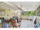 Covered patio boasts tile flooring, an outdoor space, and ceiling fans at 3601 27Th S Ave, St Petersburg, FL 33711