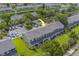 View of well-maintained townhomes with lush landscaping, parking, and community areas at 367 Countryside Key Blvd, Oldsmar, FL 34677