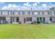 Expansive backyard with green lawn and a view of the home's rear facade at 367 Countryside Key Blvd, Oldsmar, FL 34677