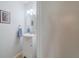 A bright bathroom features a modern vanity with storage, a mirror, and white walls at 367 Countryside Key Blvd, Oldsmar, FL 34677