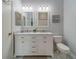 Well-lit bathroom with double vanity, marble countertop, and coordinated fixtures at 367 Countryside Key Blvd, Oldsmar, FL 34677