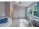 Spacious bedroom with lilac walls, a large window, and ample closet space at 367 Countryside Key Blvd, Oldsmar, FL 34677