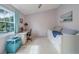 Bright bedroom with desk area, comfortable daybed, and a peaceful, light color scheme at 367 Countryside Key Blvd, Oldsmar, FL 34677