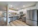 Updated kitchen with stainless steel appliances, white cabinets, and modern countertops at 367 Countryside Key Blvd, Oldsmar, FL 34677