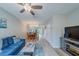 Open-concept living room with an adjacent dining area at 367 Countryside Key Blvd, Oldsmar, FL 34677