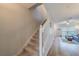 Bright entryway with carpeted stairs, light walls, and hardwood floors into the living space at 367 Countryside Key Blvd, Oldsmar, FL 34677