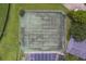 Overhead view of well-maintained community tennis courts with adjacent parking at 367 Countryside Key Blvd, Oldsmar, FL 34677