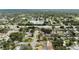 Expansive aerial shot captures a beautiful neighborhood with lush greenery and a serene pond at 3721 Casaba Loop, Valrico, FL 33596