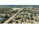 This scenic aerial view showcases a tranquil neighborhood with a mix of homes and greenery at 3721 Casaba Loop, Valrico, FL 33596