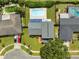 Stunning aerial view of a property with a sparkling pool, lush landscaping, and a well-maintained roof at 3721 Casaba Loop, Valrico, FL 33596