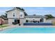Backyard oasis with a refreshing pool and a spacious deck, ideal for outdoor entertaining and relaxation at 3721 Casaba Loop, Valrico, FL 33596