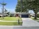 Beautifully landscaped home with a large front yard and a charming exterior, perfect for a growing Gathering at 3721 Casaba Loop, Valrico, FL 33596