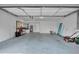 Spacious garage featuring ample storage space, with a workspace area and well-lit interiors for functionality at 3721 Casaba Loop, Valrico, FL 33596