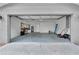 A clean and organized two-car garage features ample space, workbench, and well-lit interiors at 3721 Casaba Loop, Valrico, FL 33596