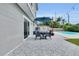 Stylish outdoor patio with comfortable seating and patterned flooring, perfect for enjoying the backyard view at 3721 Casaba Loop, Valrico, FL 33596