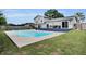 Outdoor living at its finest with a sparkling pool and ample patio space, great for enjoying sunny days at 3721 Casaba Loop, Valrico, FL 33596