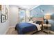 Comfortable bedroom with matching bedside tables and a window at 3877 Consolare Ct, Wesley Chapel, FL 33543
