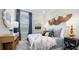 Bedroom features lots of natural light, side tables, and unique decor at 3877 Consolare Ct, Wesley Chapel, FL 33543