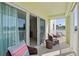 This inviting balcony features outdoor seating, perfect for enjoying the fresh air and views at 400 64Th Ave # 202, St Pete Beach, FL 33706