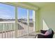 Relaxing balcony with a cozy wicker chair and great views of the outdoor scenery at 400 64Th Ave # 202, St Pete Beach, FL 33706