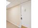 Hallway view featuring front door with gold knocker and security lock at 400 64Th Ave # 202, St Pete Beach, FL 33706