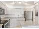 Bright kitchen featuring stainless steel appliances and granite countertops at 400 64Th Ave # 202, St Pete Beach, FL 33706