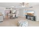 Open-concept living room and dining area with a 'Beach House' theme and decor at 400 64Th Ave # 202, St Pete Beach, FL 33706
