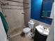 Bathroom with a tiled walk-in shower, modern fixtures, and elegant finishes at 4707 Barrett Ct, Tampa, FL 33617
