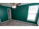 Bedroom with neutral carpet, ceiling fan and a window letting in natural light at 4707 Barrett Ct, Tampa, FL 33617