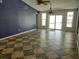 Bright living room featuring a unique tiled floor, ceiling fan and sliding door at 4707 Barrett Ct, Tampa, FL 33617