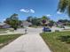 Street view of a quiet neighborhood featuring well-maintained lawns and varied home styles at 4707 Barrett Ct, Tampa, FL 33617
