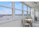 Balcony with chairs, a table, and stunning views of the water at 4775 Cove Cir # 803, St Petersburg, FL 33708