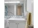 Clean bathroom features a vanity, toilet, and shower with blue and white flower-patterned shower curtain at 4775 Cove Cir # 803, St Petersburg, FL 33708