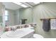 Bathroom featuring floral motif, vanity with white sink, and natural light at 4775 Cove Cir # 803, St Petersburg, FL 33708