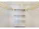 Walk-in closet featuring shelving, providing ample storage space at 4775 Cove Cir # 803, St Petersburg, FL 33708