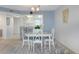 Open dining area with stylish furnishings flows seamlessly into the adjacent kitchen and living spaces at 4775 Cove Cir # 803, St Petersburg, FL 33708