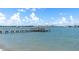 Picturesque pier with waterfront views, offering a tranquil spot to enjoy the ocean breeze and skyline at 4775 Cove Cir # 803, St Petersburg, FL 33708