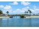 Scenic bridge over calm waters, surrounded by palm trees and lush greenery, offering a serene and picturesque setting at 4775 Cove Cir # 803, St Petersburg, FL 33708