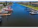 Wide view of residential waterway with docks and multiple boats at 4849 Floramar Ter, New Port Richey, FL 34652