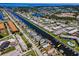 Wide aerial view of canal community with condo pools and boating docks at 4849 Floramar Ter, New Port Richey, FL 34652