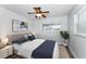 Bedroom with ceiling fan, hardwood flooring, and bright natural light at 4849 Floramar Ter, New Port Richey, FL 34652