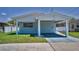 Charming single-story home with a covered parking area and well-maintained landscaping at 4849 Floramar Ter, New Port Richey, FL 34652